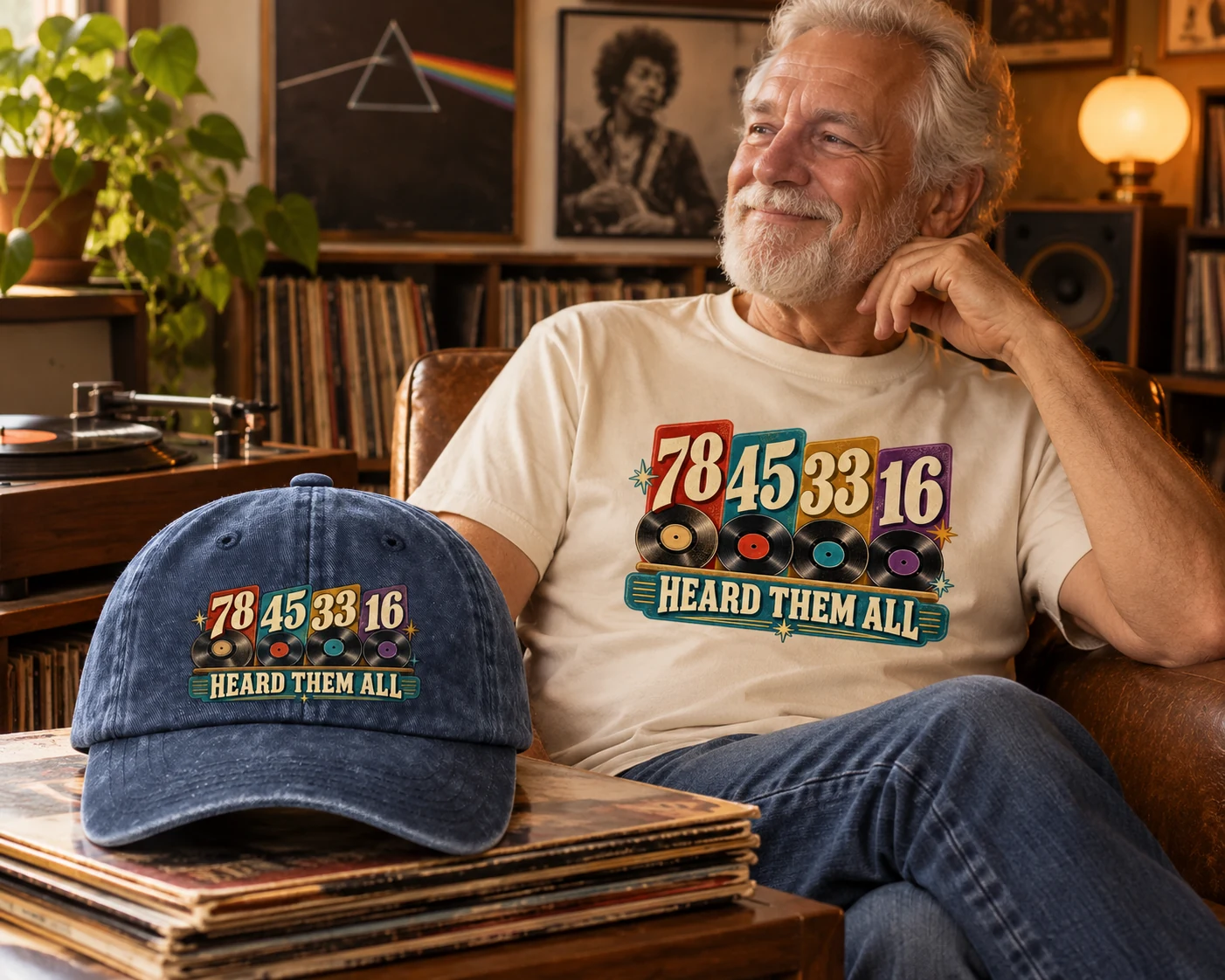 Senior man wearing a cream Heard Them All T-shirt beside a navy cap and vinyl records