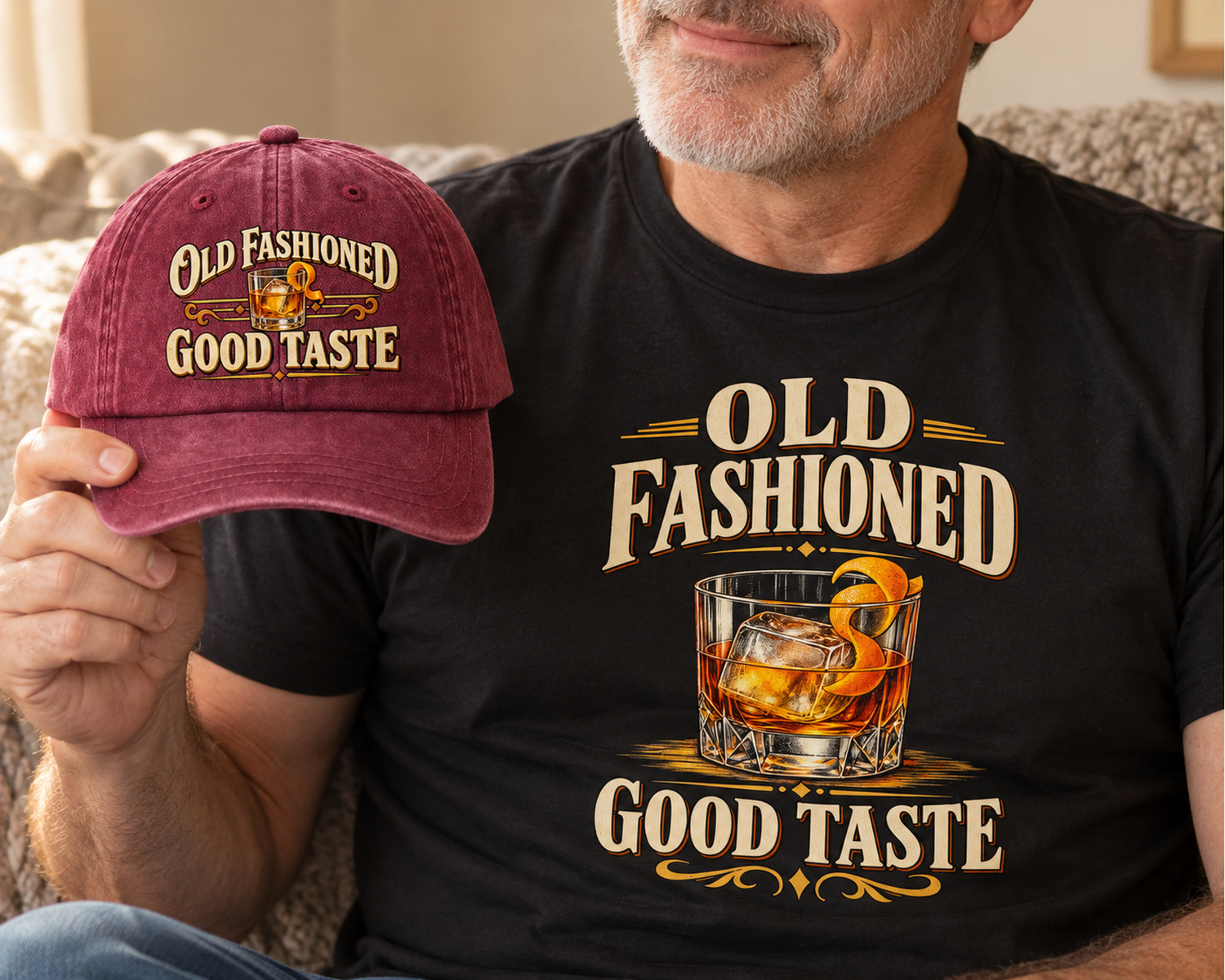 Wine red Old Fashioned Good Taste cap held beside black printed tee
